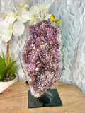 Dark Purple Hematite included Amethyst geode on stand