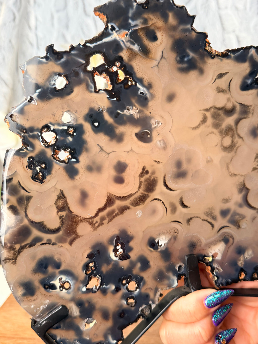 Large Black and Brown Orby Agate slice on stand
